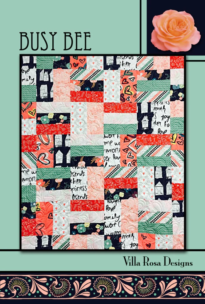 Colorful quilt design featuring various fabric patterns in shades of red, green, and navy, with a title 'BUSY BEE' and branding 'Villa Rosa Designs'.