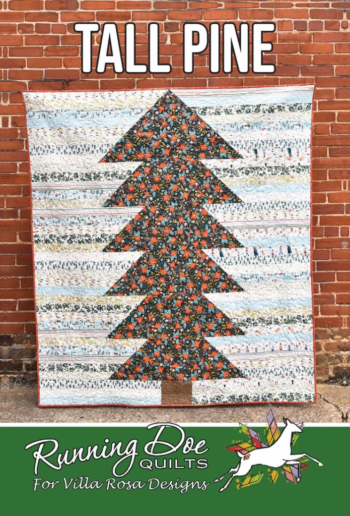 A patchwork quilt design featuring a tall pine tree on a colorful background, with the words 'TALL PINE' at the top and 'Running Doe Quilts For Villa Rosa Designs' at the bottom.