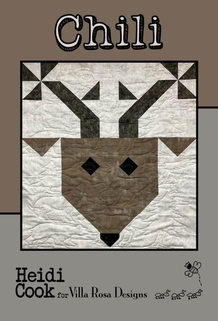 Quilt pattern titled 'Chili' featuring a stylized reindeer design in earthy tones, created by Heidi Cook for Villa Rosa Designs.