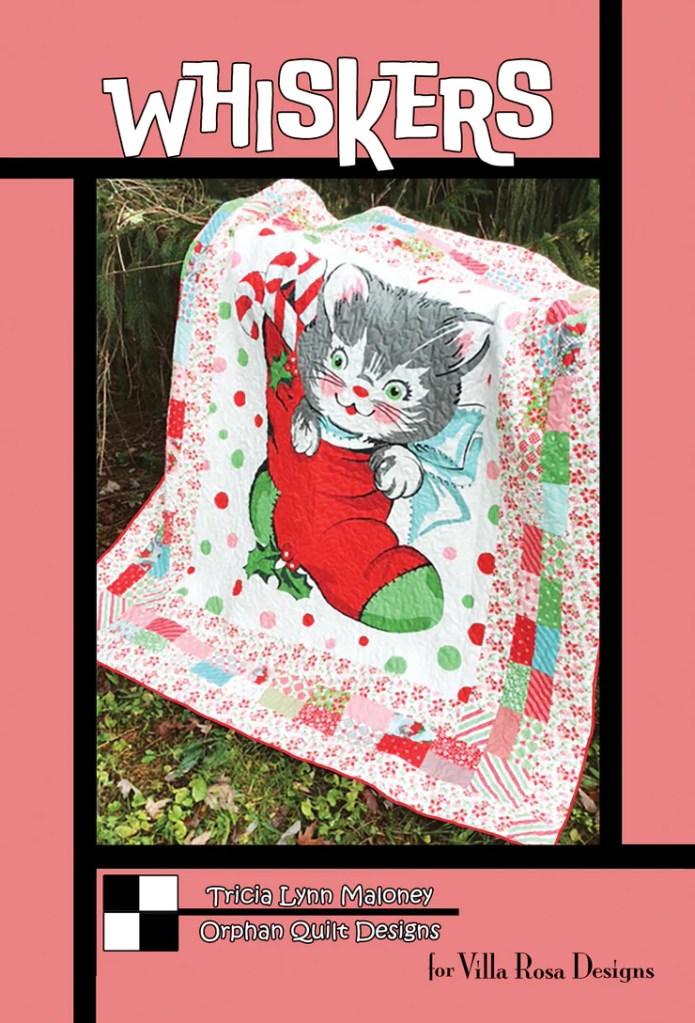Cover of the quilt pattern titled 'Whiskers' featuring a playful kitten holding a candy cane, with a colorful quilt background decorated with festive patterns.