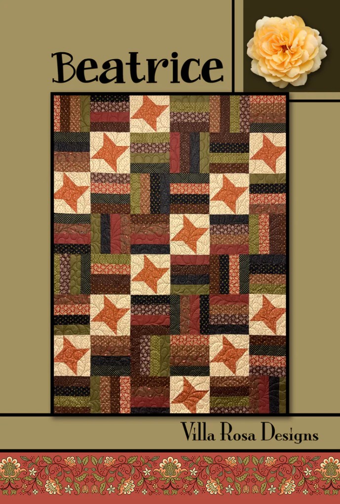 A quilt design titled 'Beatrice' featuring a patchwork of various colored fabric squares and stars, designed by Villa Rosa Designs.