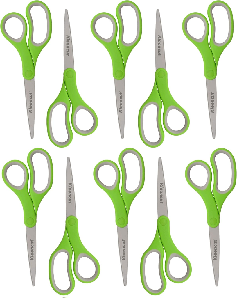 A collection of green scissors arranged in a pattern, showcasing their design and features.