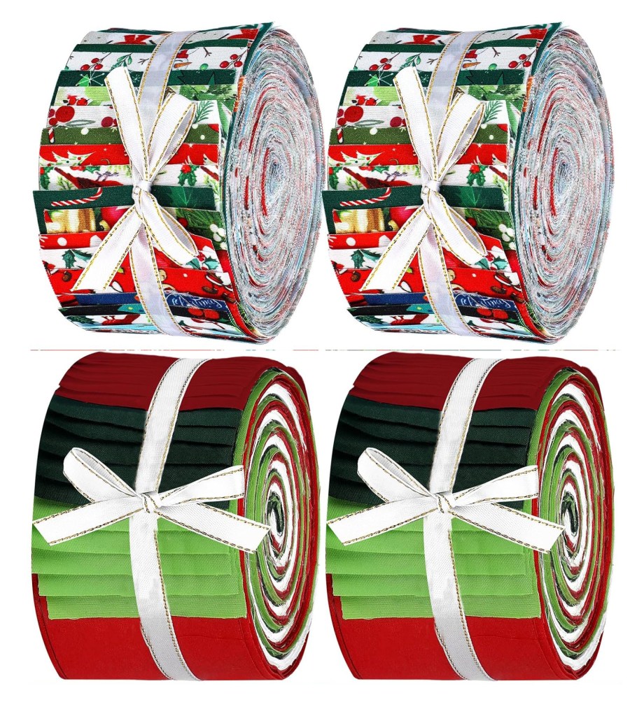 Four rolls of Jelly Rolls, featuring festive red and green fabric patterns, tied with white ribbons.