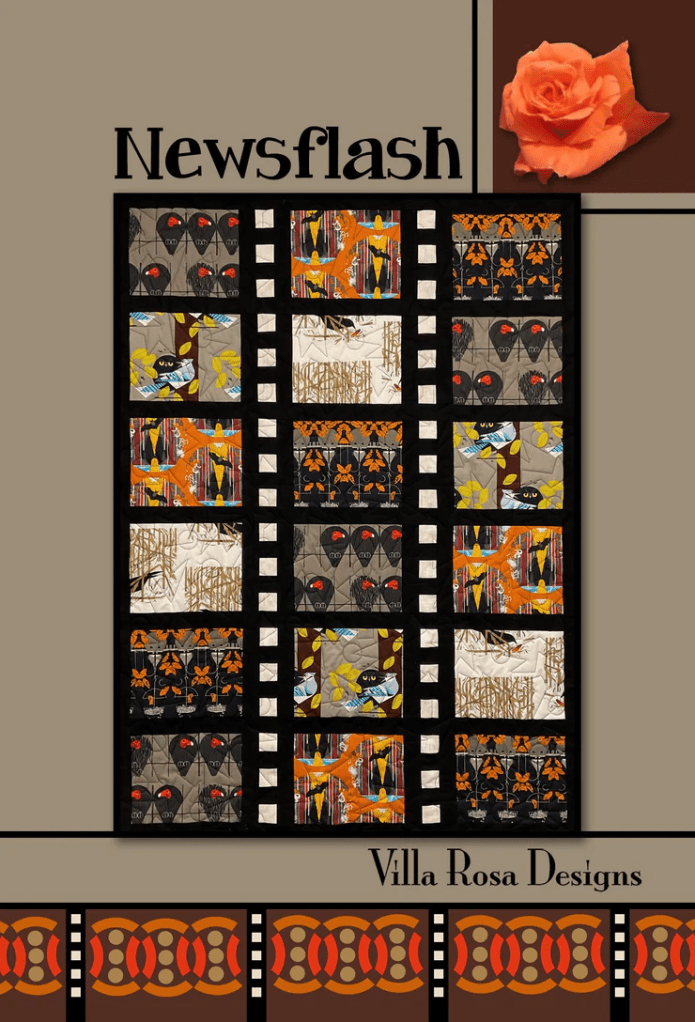 A colorful quilt design featuring a variety of patterns in shades of orange, black, gray, and white, with a decorative border and the title 'Newsflash' at the top. Includes a rose image in the corner and branding for 'Villa Rosa Designs' at the bottom.