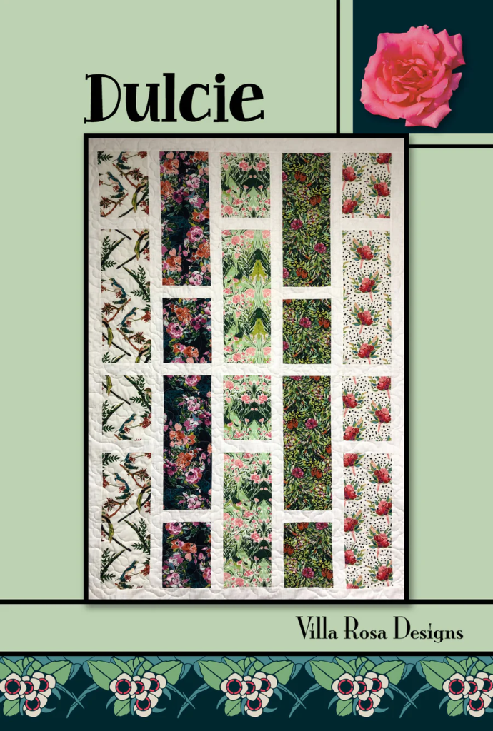 A quilt design featuring multiple floral patterns, showcasing a variety of vibrant colors and textures. The top reads 'Dulcie,' with the designer's name 'Villa Rosa Designs' at the bottom.
