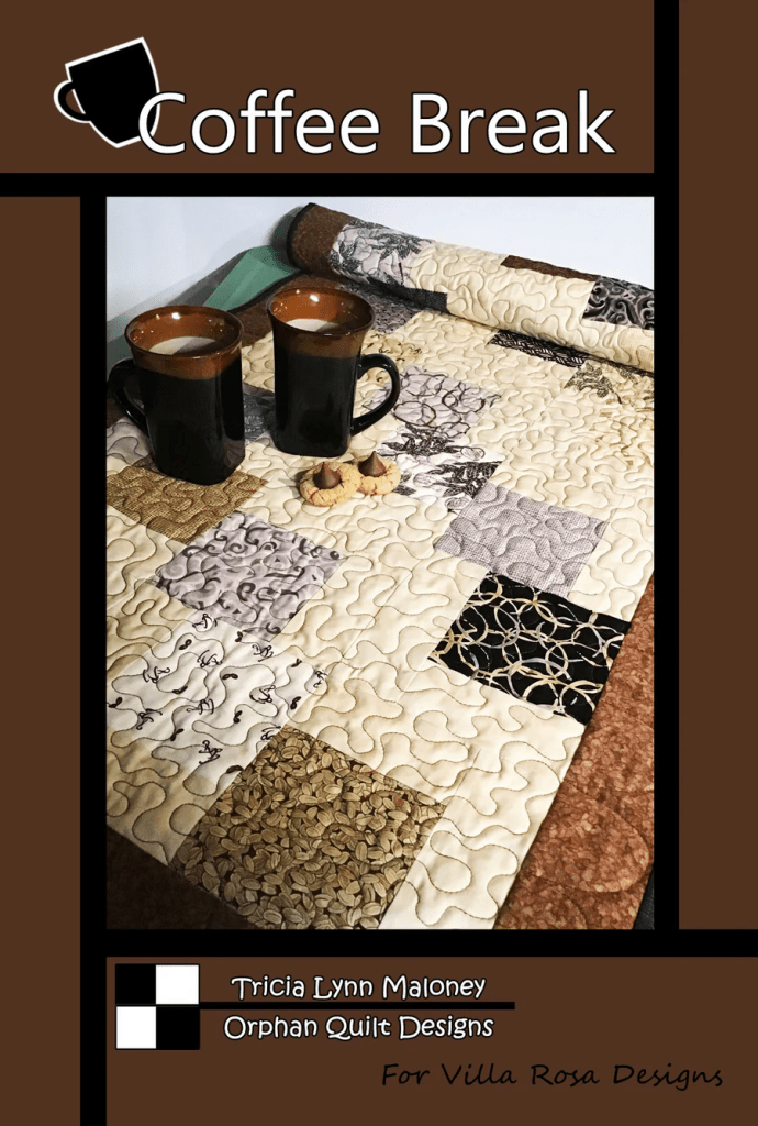 A cozy scene featuring two black mugs filled with coffee, accompanied by a plate of cookies, set on a quilt with various patterned patches. The title 'Coffee Break' is prominently displayed, along with the designer's name and branding.