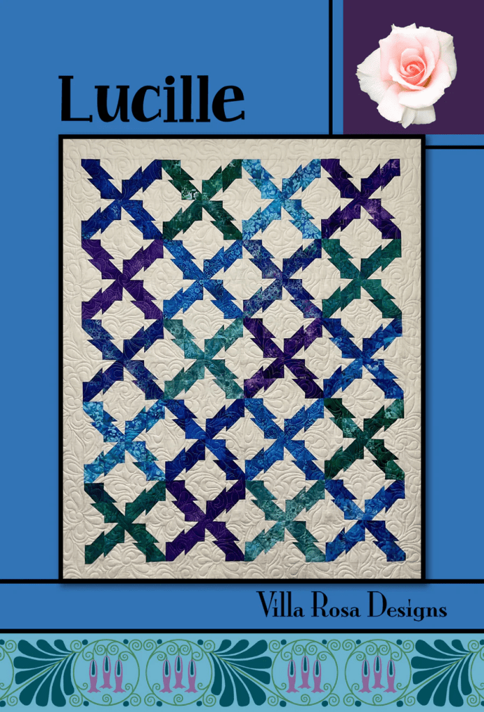 A vibrant quilt design titled 'Lucille' featuring geometric patterns in shades of blue, green, and purple, with a decorative border and a rose graphic.