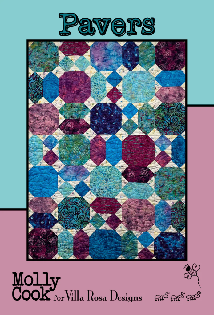Quilt design titled 'Pavers' featuring a variety of octagonal and rectangular fabric pieces in shades of blue, purple, and green, with intricate patterns.