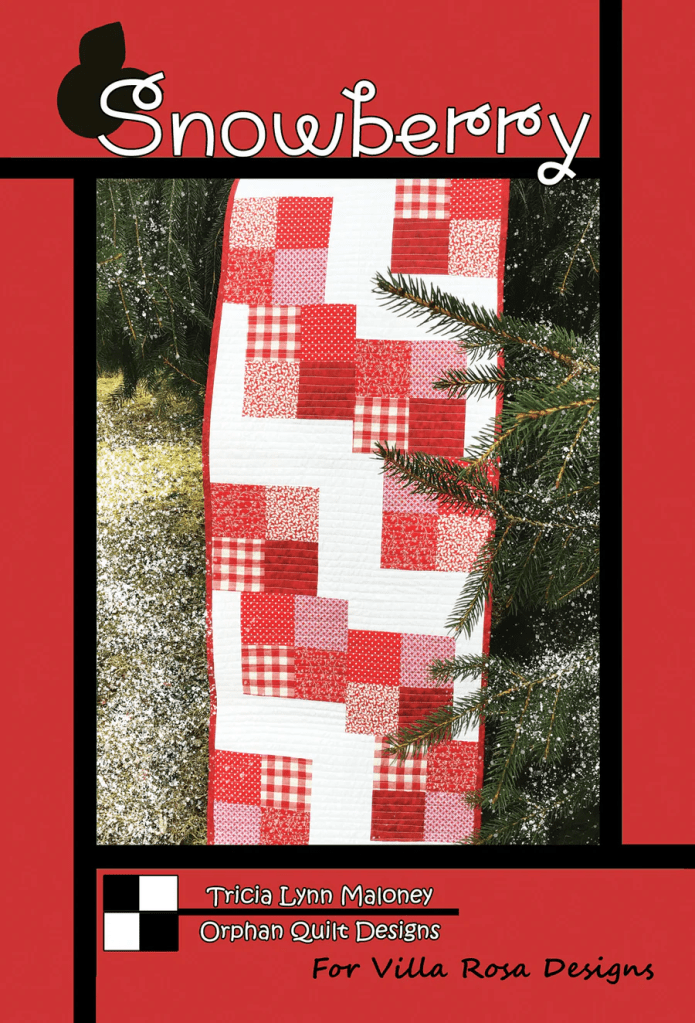 Cover image for 'Snowberry' quilting pattern by Tricia Lynn Maloney, featuring a patchwork quilt in red and white against a wintery backdrop with snow and evergreen branches.