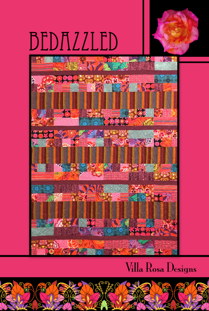 Colorful quilt design featuring a patchwork of various floral and geometric patterns, with a vibrant pink background and a decorative floral accent in the top right corner. 'Bedazzled' is prominently displayed at the top, along with 'Villa Rosa Designs' at the bottom.