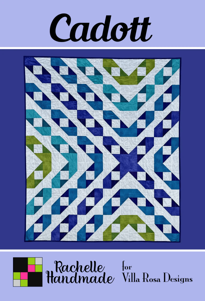 A vibrant quilt design featuring geometric patterns in shades of blue, green, and white, titled 'Cadott' by Rachelle Handmade for Villa Rosa Designs.