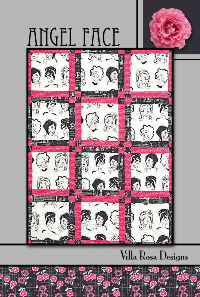 A colorful quilt titled 'Angel Face' featuring artistic fabric squares depicting various hairstyles, framed with pink and black borders. The design includes a floral motif at the bottom with branding 'Villa Rosa Designs'.