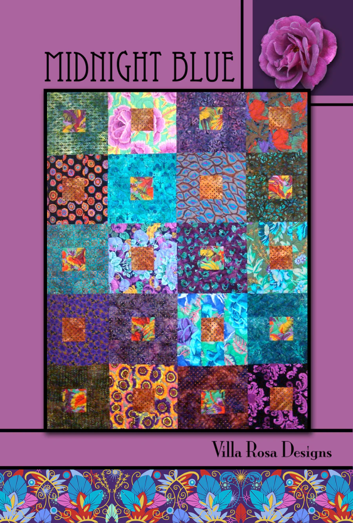A colorful quilt design titled 'Midnight Blue' featuring various fabric patterns in shades of blue, purple, and green, with a rose decoration in the top right corner and the text 'Villa Rosa Designs' at the bottom.