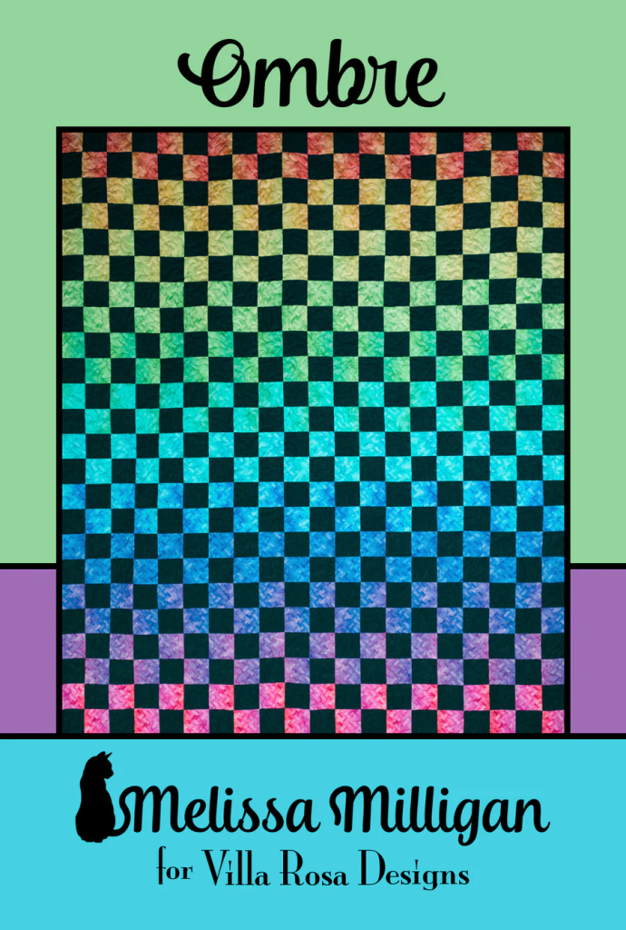 A colorful ombre quilt design featuring a checkerboard pattern. The quilt transitions through various shades, including pink, orange, blue, and green. The design is attributed to Melissa Milligan for Villa Rosa Designs.