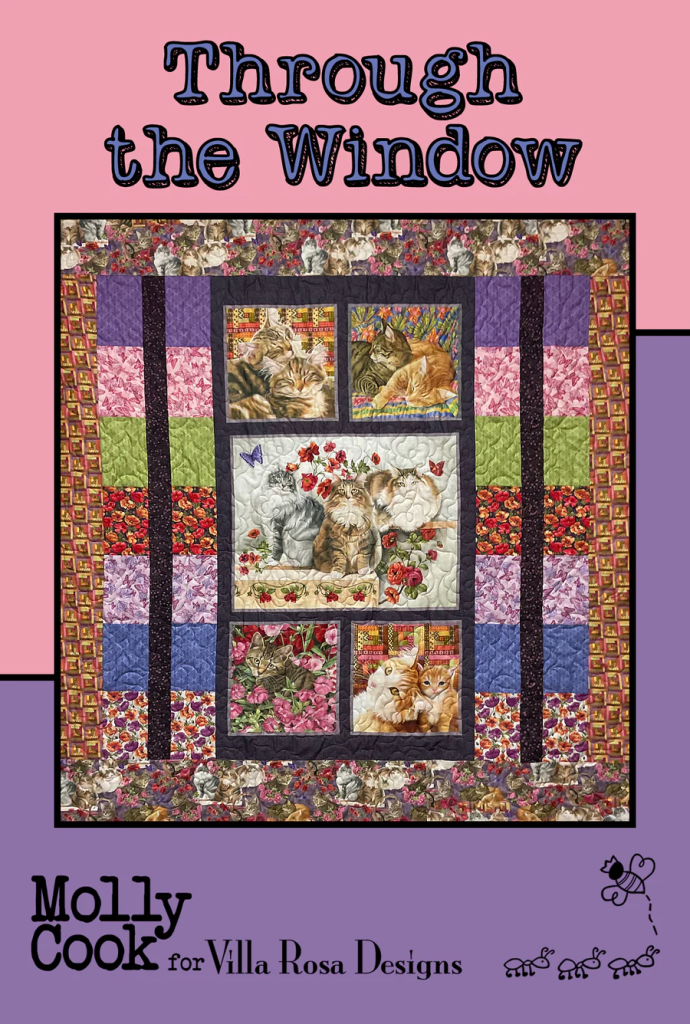 A colorful quilt titled 'Through the Window' featuring various cat illustrations framed by patterned borders, designed by Molly Cook for Villa Rosa Designs.