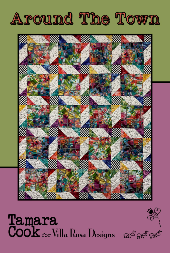 Colorful quilt titled 'Around The Town' with various patchwork squares, designed by Tamara Cook for Villa Rosa Designs, displayed on a green and purple background.