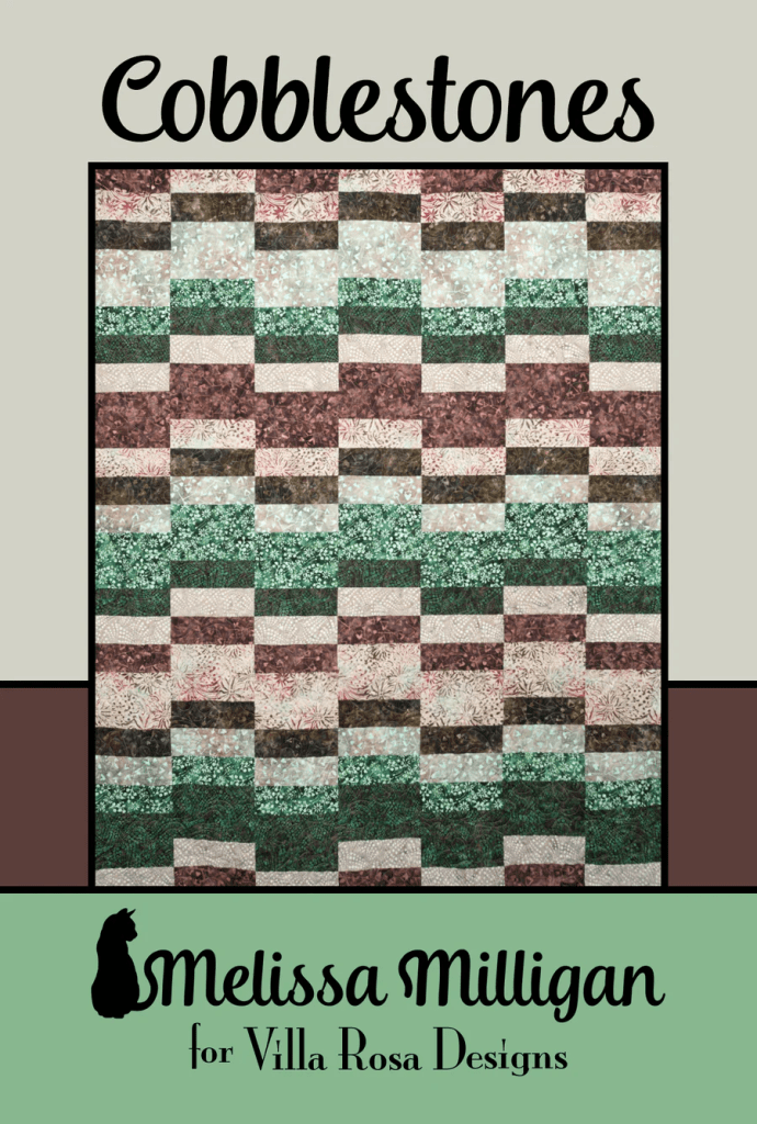 A quilt pattern titled 'Cobblestones' featuring a design made up of various rectangular blocks in earthy tones of green, brown, and beige, with floral and abstract prints, accompanied by the text 'Melissa Milligan for Villa Rosa Designs' at the bottom.