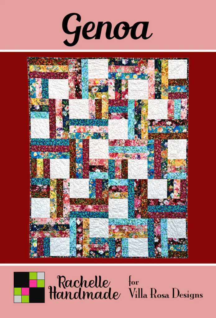 A colorful quilt titled 'Genoa' with a floral pattern, featuring a patchwork design of various fabrics in vibrant hues, on a crimson background.