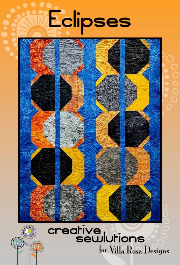 A colorful quilt titled 'Eclipses' featuring an intricate pattern of octagonal shapes in black, gray, orange, and blue. The quilt is framed against an orange background with decorative design elements. The design is attributed to Creative Sewlutions for Villa Rosa Designs.