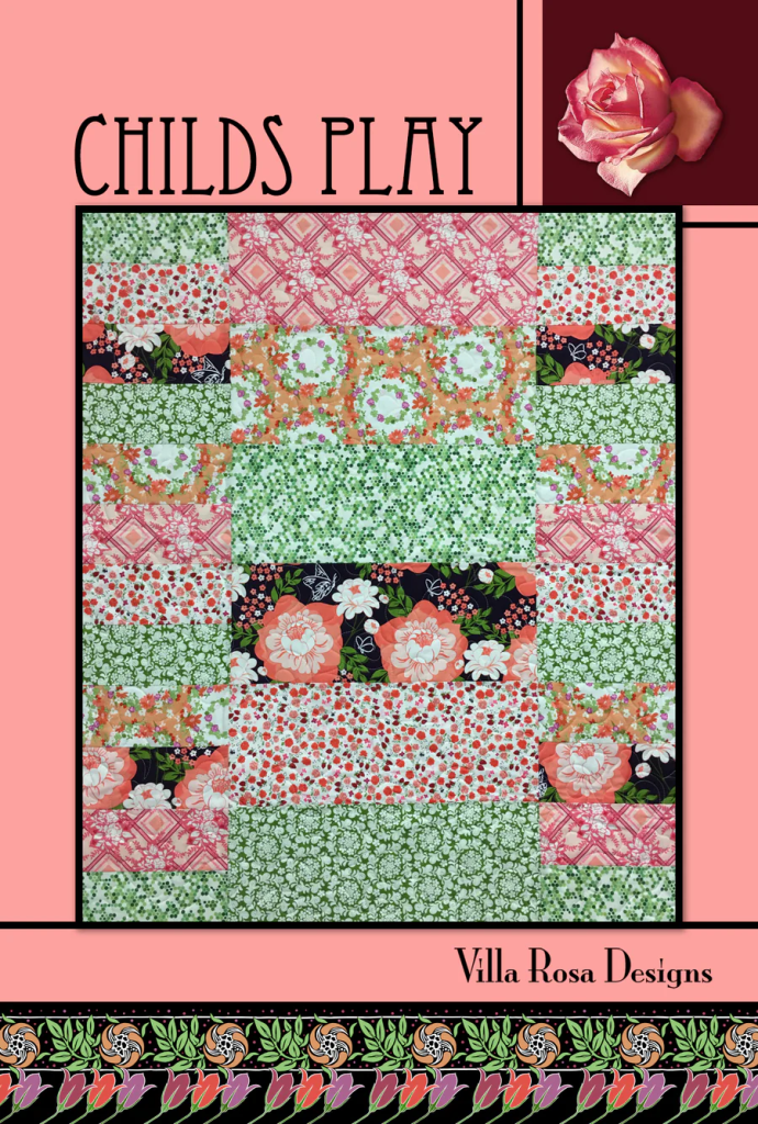 Colorful quilt design featuring floral patterns in various shades of pink, green, and black, titled 'Child's Play' from Villa Rosa Designs.