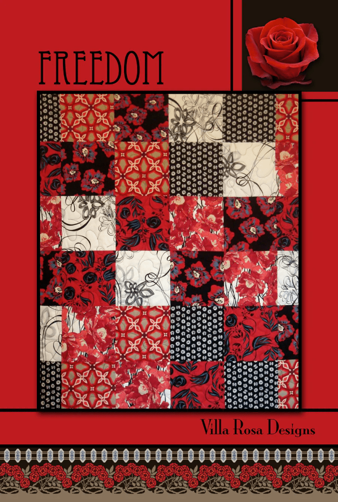 A quilt design featuring a patchwork of red, black, and white fabrics, with floral and geometric patterns. The word 'FREEDOM' is prominently displayed at the top, alongside a graphic of a red rose. The design is branded with 'Villa Rosa Designs' at the bottom.