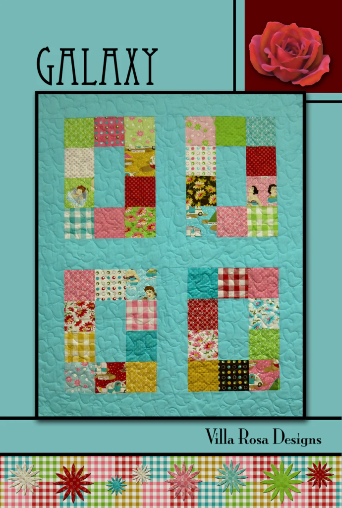 A colorful quilt design featuring patchwork squares in various patterns and colors, labeled 'GALAXY' at the top and 'Villa Rosa Designs' at the bottom, with decorative floral elements.