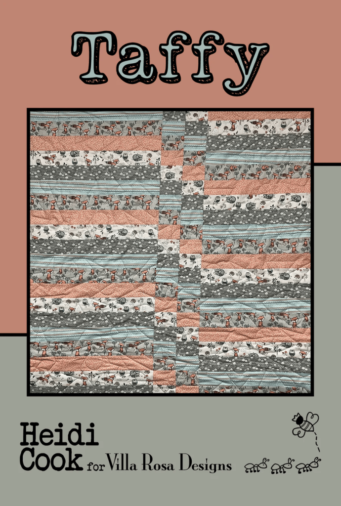 A quilt design named 'Taffy' by Heidi Cook for Villa Rosa Designs, featuring a patchwork of colorful and patterned fabric strips.