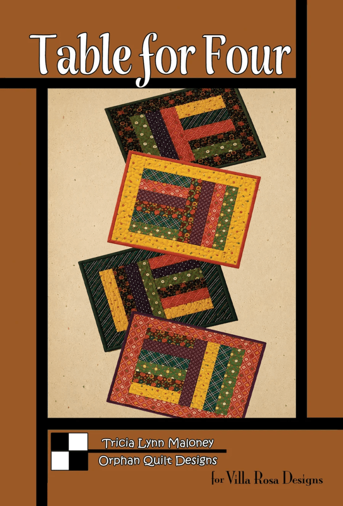 Cover of the 'Table for Four' quilt pattern featuring four colorful quilted placemats with various patterns, set against a textured background.