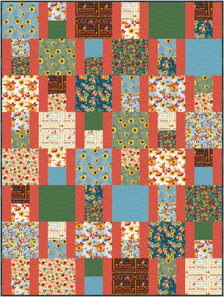 A colorful patchwork quilt featuring a variety of floral and autumn-themed patterns, including sunflowers, autumn leaves, and pumpkins, arranged in a grid layout.